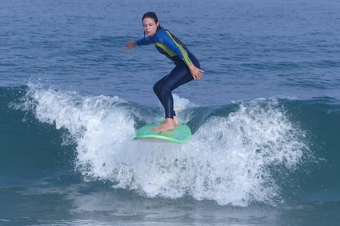 Professional Surfing lessons in the heart of Tel Aviv - Warm-up, safety, and the pop-up you practice for real