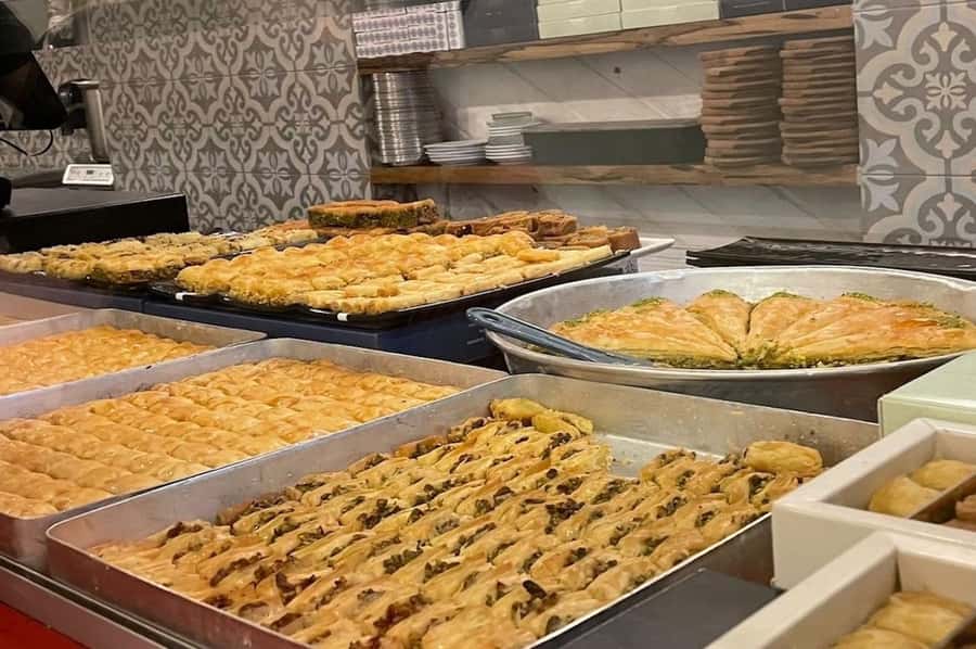 Tel Aviv:Food & History Tour of Jaffa Old City & Flea Market - Old City walking stops: Clock Tower Square and the religious mix of Jaffa